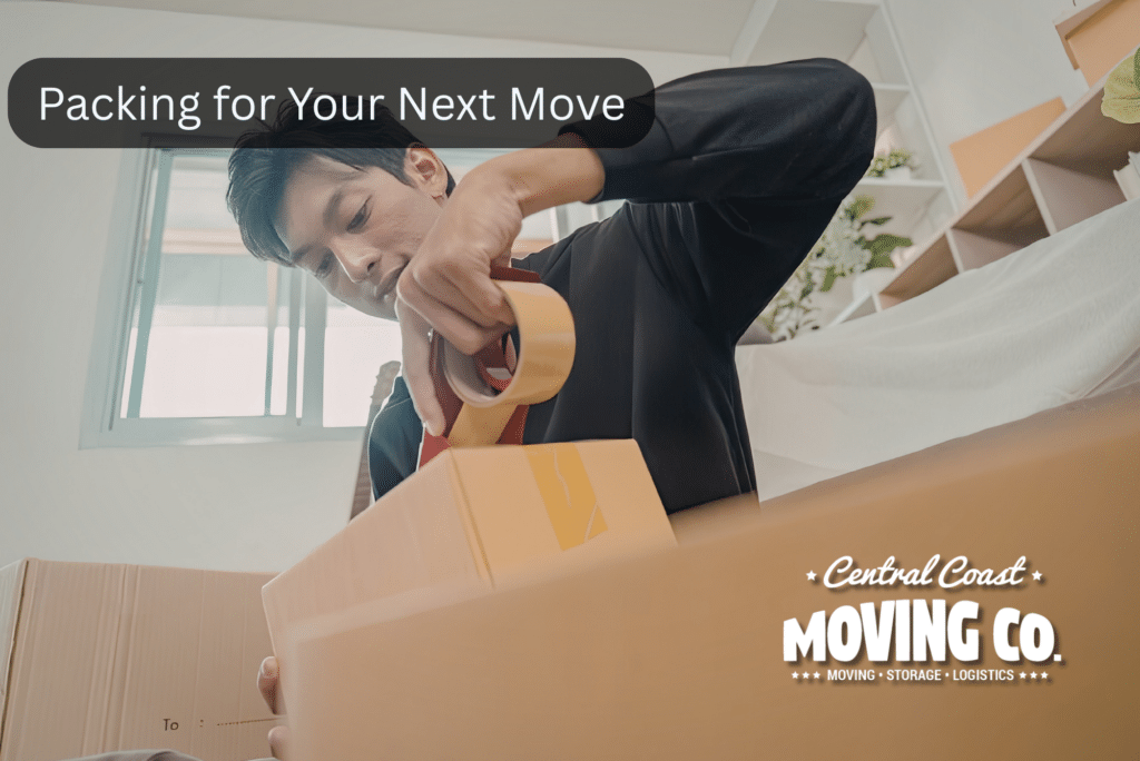 man sealing packed box