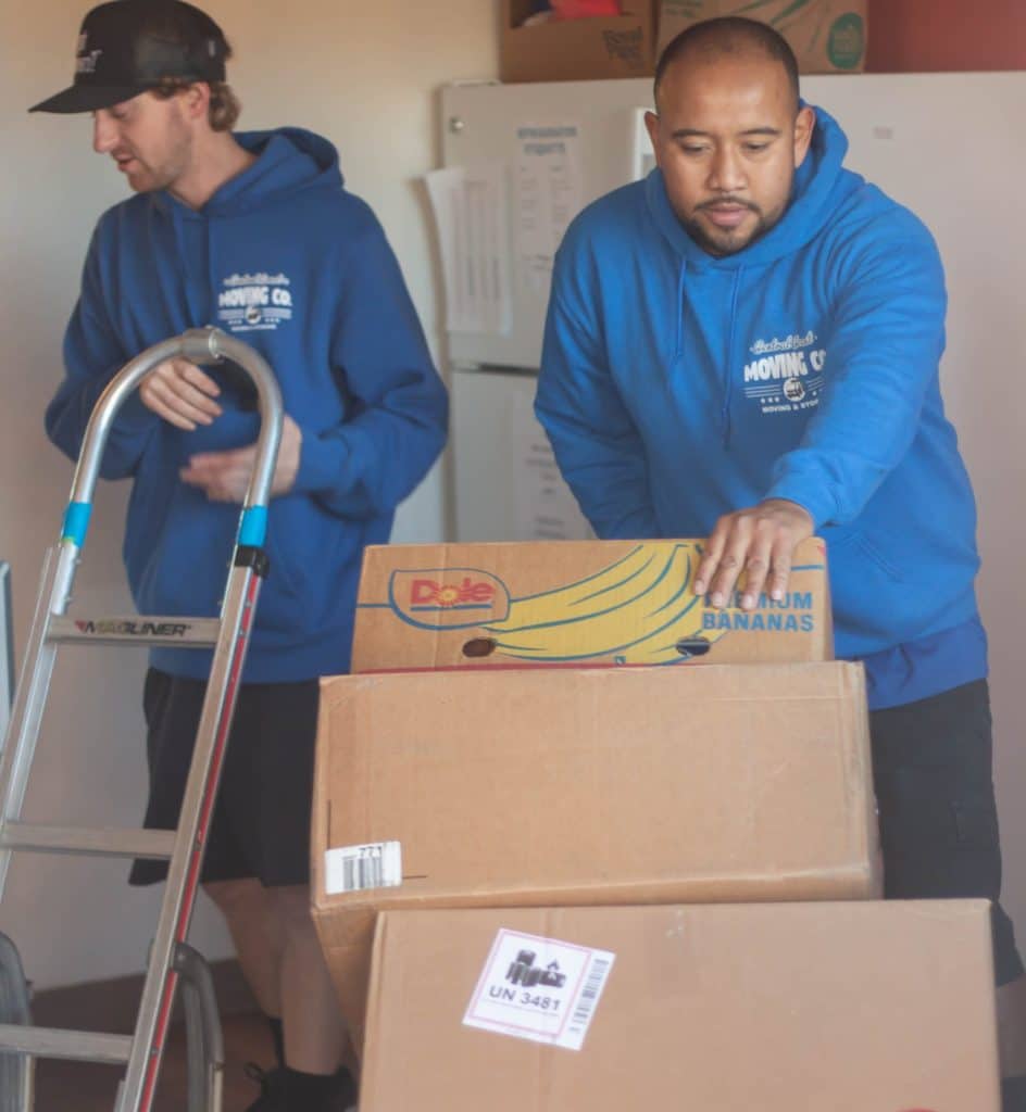 central coast moving team member pushing cart